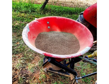 Broadcast spreader with organic poultry litter